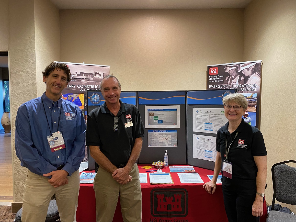 Photo of Brian Rast, Ken Wade, and Julie MacLachlan who exhibited at the Kansas Silver Jackets work and Corps programs at the Kansas Association of Floodplain Managers annual conference August 31st and September 1st in Lawrence, KS.